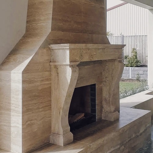 Custom chimney surround in travertine