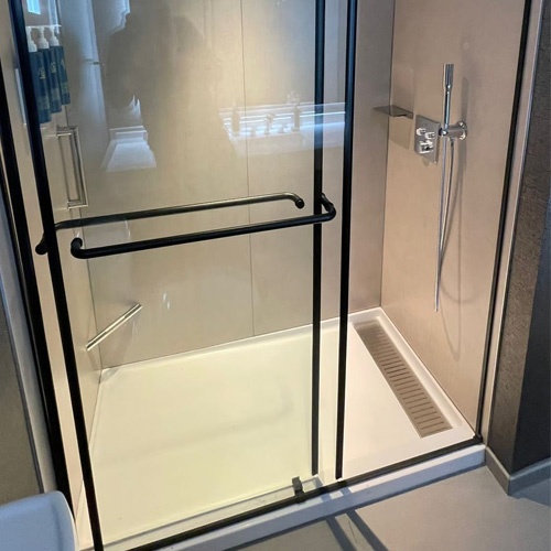 Glass Shower Door on Culture Marble Shower Pan with Trench Drain