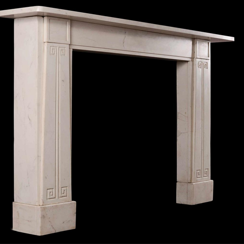 An antique fireplace with clean lines