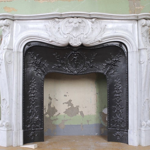 LOUIS XV ROSACES FIREPLACE MANTEL CARVED IN WHITE CARRARA MARBLE WITH FLORAL CAST IRON INSERT