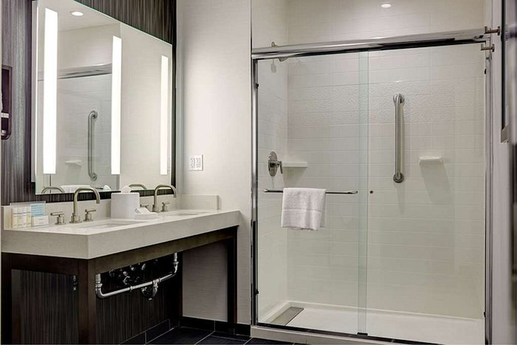Glass shower door and culture marble base