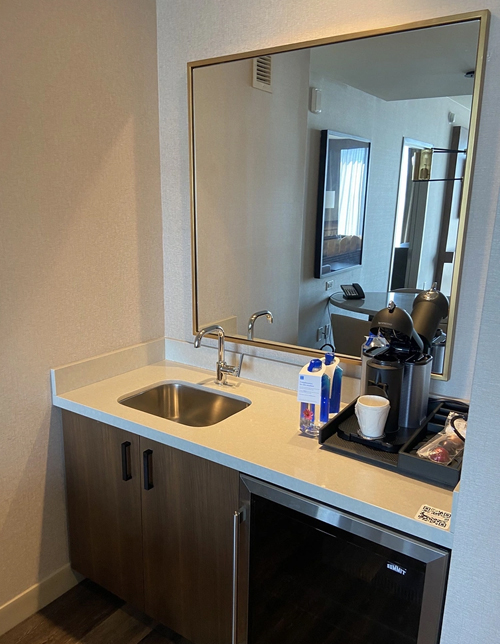 Kitchenette cabinet woodwork and quartz countertop in hotel Grand Hyatt
