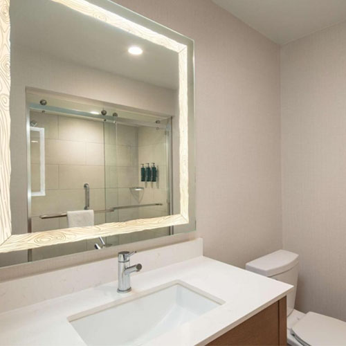 bath vanity shower glass and LED mirror for Doubletree by Hilton in Sacramento