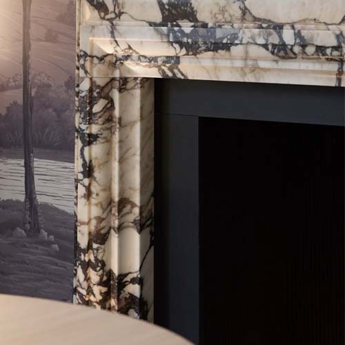 A fireplace in the dining room becomes a design feature