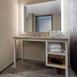 Bath Vanities with Polished Chrome Metal Base in Cambria Hotel