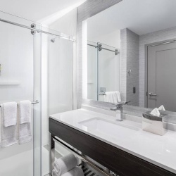 Bath Vanities with Pylwood Apron and Metal Base in Staybridge Suites