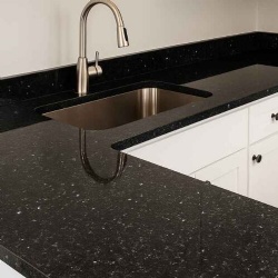 Black pearl granite kitchen countertop with sink and faucet