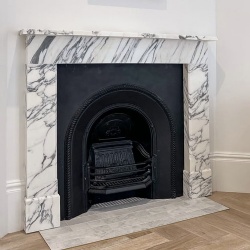 Contemporary fireplace mantel in Abrabescato marble