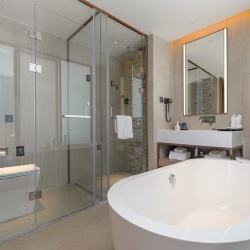 Custom glass and mirror for boutique hotel bathroom