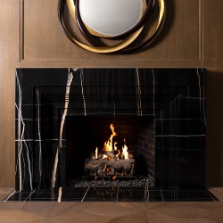 Dramatic fireplace surround by marble Nero Dorato