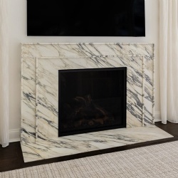 Fireplace design featuring Calacatta Monet marble