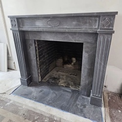 Fireplace surround in Pietra Gray marble