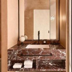 Marble Rosso Levanto bathroom vanities with storage cubbies
