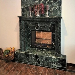 Marble fireplace mantel with back wall panel in marble Verde Alpi
