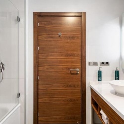 Modern hotel bathroom wood door