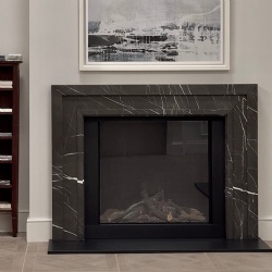 Modern stone fireplace mantel in Pietra Grey marble