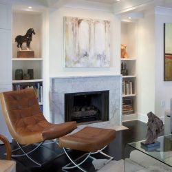 Modern white living room with a marble fireplace