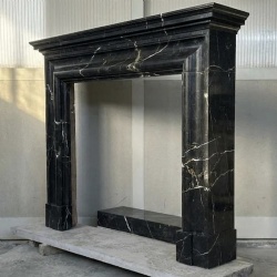 Nero Marquina black fireplace surround elegant living room decor