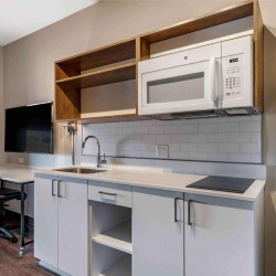 Small Kitchen Cabinetry and Countertop with Plumbing and Cooktop