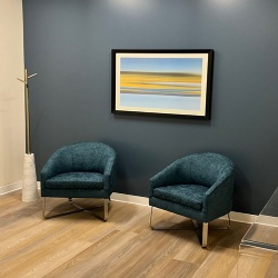 Upholstered Lounge Chair with Wall Artwork