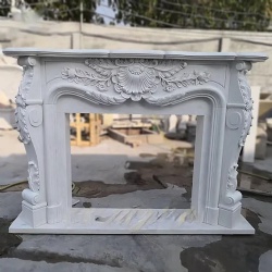 White marble fireplace showcasing Rococo style
