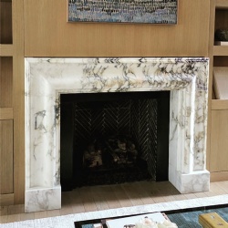 custom bolection fireplace surround from marble slab
