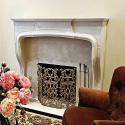 custom limestone fireplace surround by tresjoli design